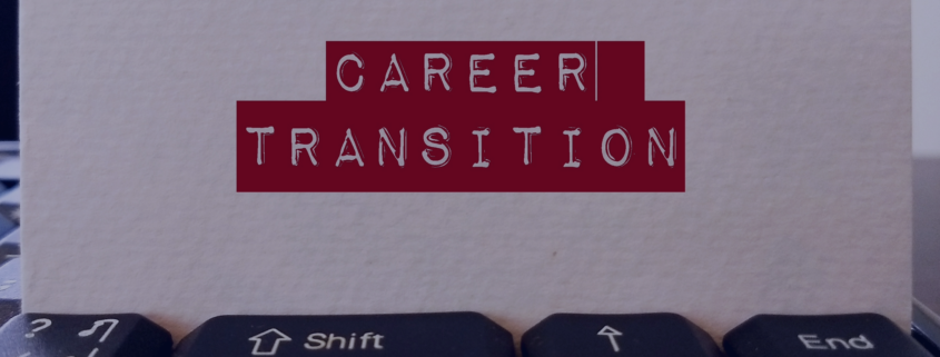 Close-up of a keyboard with a card labeled CAREER TRANSITION, symbolizing job seekers' end-of-year career change strategies