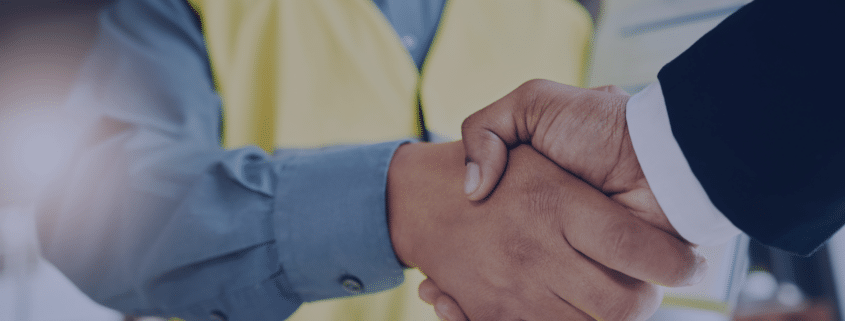 Engineering recruitment handshake symbolizing the successful hiring of top talent in a competitive market for Measured Ability.