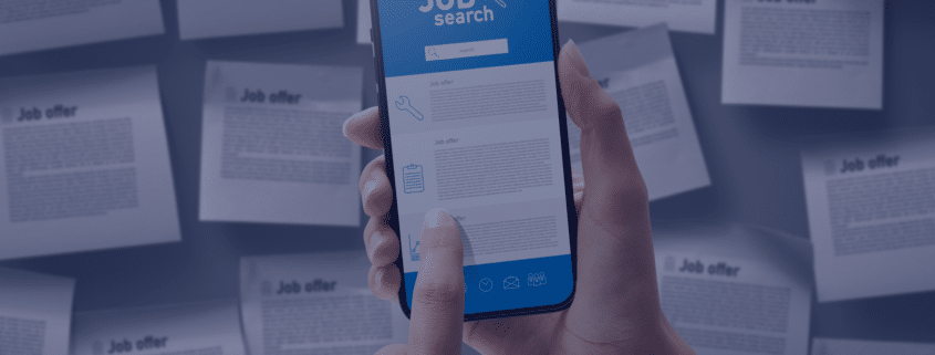 Hand holding a smartphone with a job search application on the screen amidst scattered job offer papers, representing online job-seeking strategies in South Africa