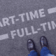 Person standing at a crossroads with arrows pointing to 'PART-TIME' and 'FULL-TIME', representing the choice between contract work and full-time employment.