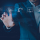 Business professional interacting with virtual AI and automation interface, representing job security and future workforce preparation in South Africa.