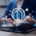 Businessperson using a tablet with recruitment and target icons hovering above, symbolizing how a recruitment agency supports H2 hiring goals