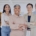 Diverse executive leadership team standing confidently in a modern office, representing how a recruitment agency supports inclusive executive hiring.