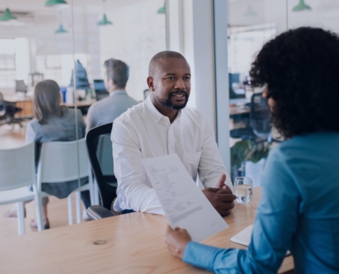 HR professional interviewing a leadership candidate in a modern South African office, demonstrating how recruitment services support executive hiring decisions.