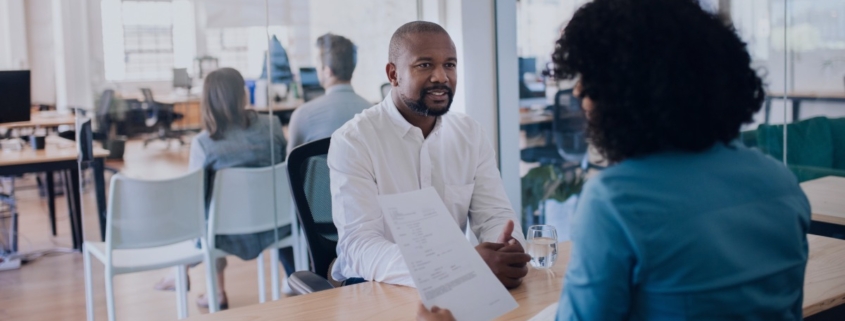 HR professional interviewing a leadership candidate in a modern South African office, demonstrating how recruitment services support executive hiring decisions.