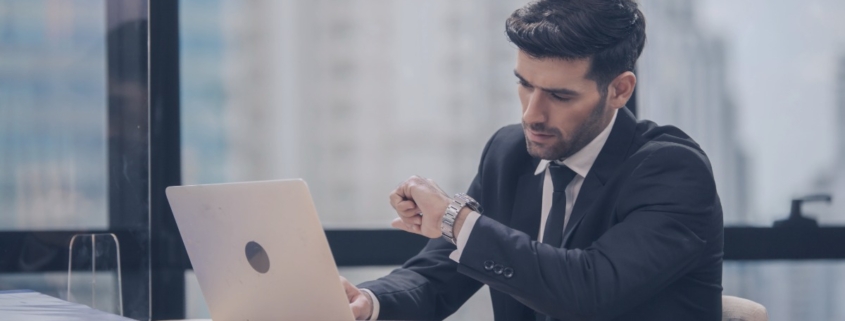 Hiring manager waiting for candidate response while recruitment services manage communication to prevent candidate ghosting.
