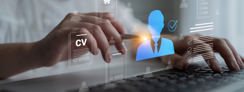 Person using a laptop with digital CV documents and candidate profile icons, representing transferable skills after job loss and new career opportunities in South Africa.