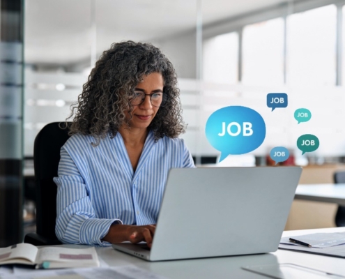 Employee researching job opportunities online as digital job alerts highlight the risk of staff becoming visible to competitors before resigning