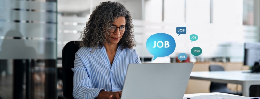 Employee researching job opportunities online as digital job alerts highlight the risk of staff becoming visible to competitors before resigning